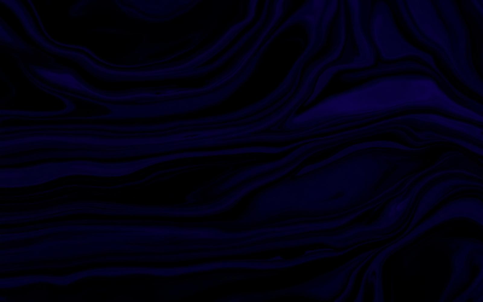 Close-up reflective purple and black swirling abstract pattern